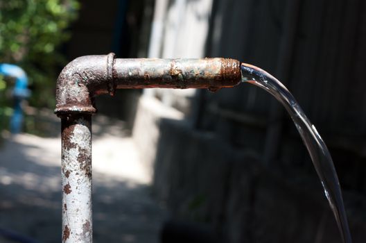 old rusty tap water