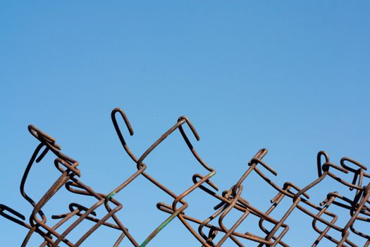 metal fence against the blue sky