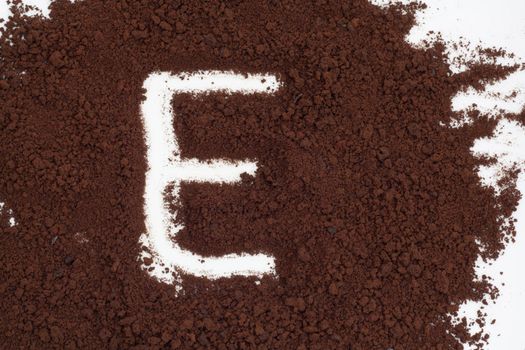 letter on the background of instant coffee