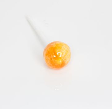 Orange candy isolated in white background 