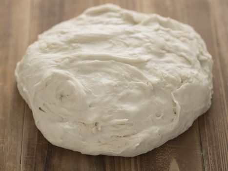 close up of flour dough on table