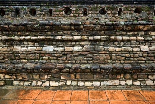 An ancient stone wall of Buddhist temple