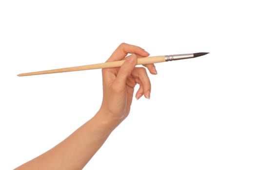 woman drawing a picture with a brush