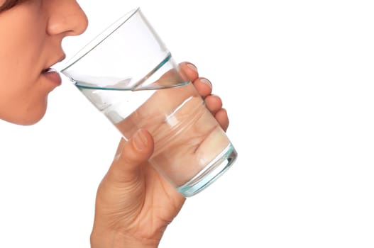 woman drinking mineral water from the glass