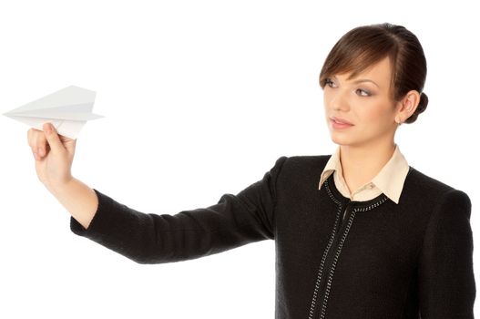 Businesswoman throwing white paper plane on the break