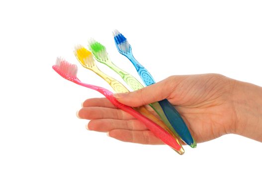 colored brush for toothpaste in the doctor's hand