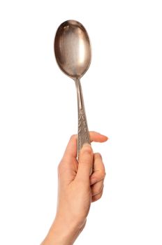 woman holding tablespoon in the hand for feeding a sick person