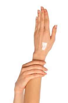 woman lubricates the hands skin with vitaminized cosmetic cream