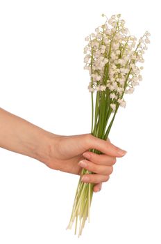 Woman holding lily of the valley in the hand