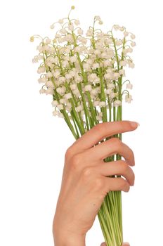 Woman holding lily of the valley in the hand