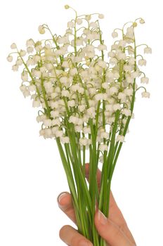 Woman holding lily of the valley in the hand