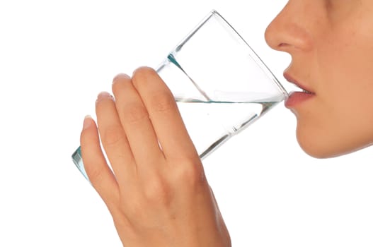 woman drinking mineral water from the glass