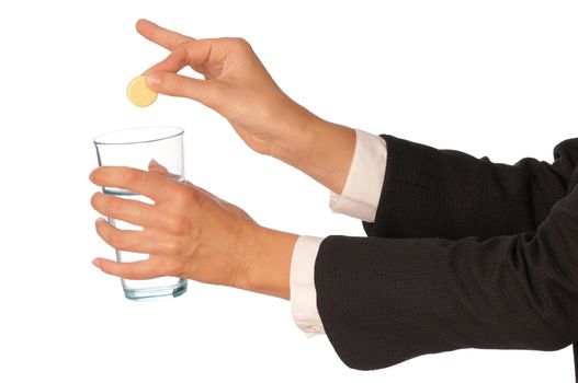 Businesswoman throws a pill from headache to the glass with water
