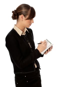 business woman writes notes for business plan