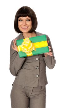 Woman holding a green box with yellow bow as a present