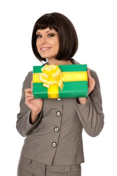 Woman holding a green box with yellow bow as a present