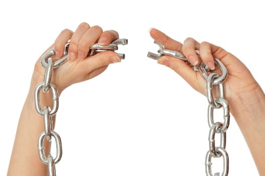 woman tearing a heavy chain by hands as a symbol of freedom