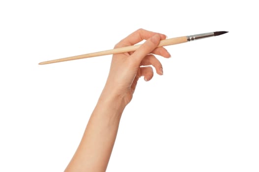 woman drawing a picture with a brush