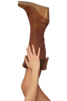 brown leather boots with broken zipper on the leg