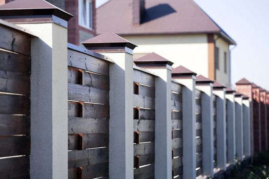 Fence and the modern house in suburban settlement