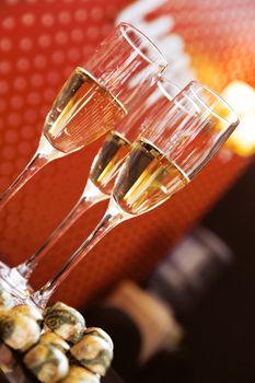 Glasses with champagne and sweets on a festive table