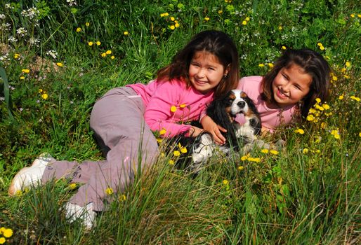 twins sister and little dog cavalier king charles