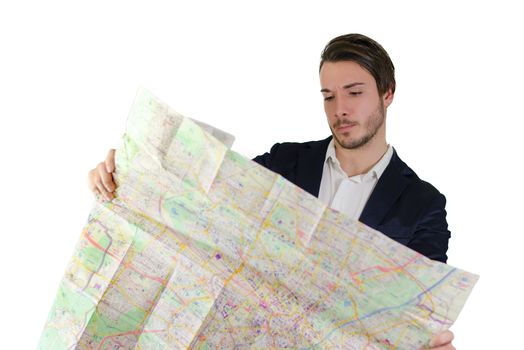 Elegant young man confused, lost and puzzled reading city map