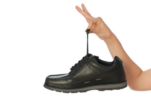 New model of black urban footwear in saleswoman's hands