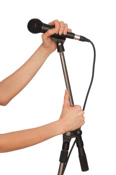 woman holding big black microphone for singing