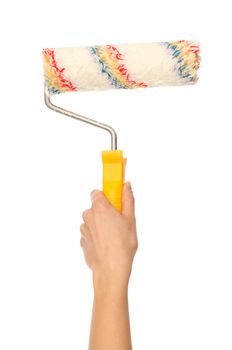 worker painting a wall with colored paint roller to redecorate her flat