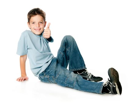 smiling boy with thumbs up on white background
