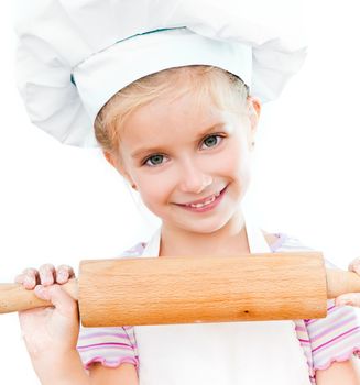 beautiful little girl with a rolling pin on a white background