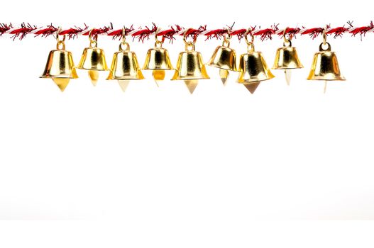 Golden bell holding ribbon rope isolate on white background