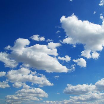 Blue sky background with tiny clouds