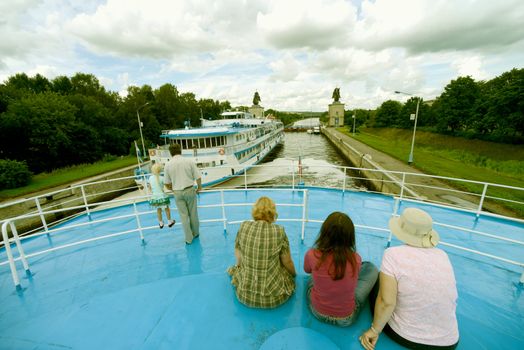 Passangers on the cruise ship board. Taken  on the river lock of Moscow canal, on July 2012