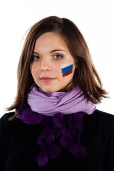 Photo of a young and beautiful woman with a painted face the Russian flag