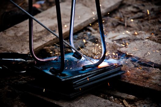 Welding piece of iron.