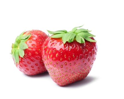 Two fresh strawberries isolated on white background