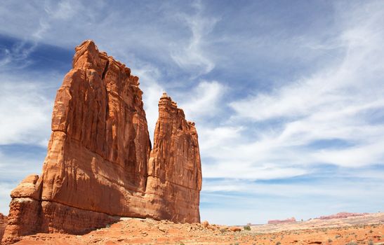 Courthouse Towers Ridge in Arches National Park with dramatic Blue Sky
