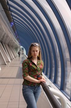 Young attractive woman in corridor of modern building