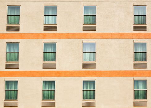 Three rows of windows on an apartment building