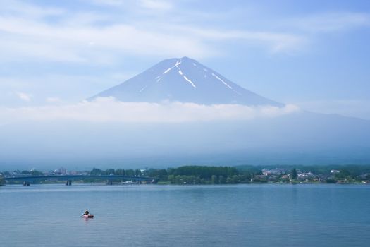 Kawaguchi Lake infront of mount Fuji and fisherman