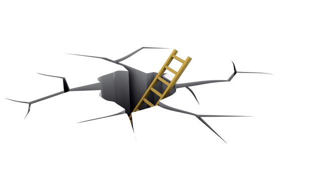 Ladder in a crevice, an exit from a hole. A rescue concept from a dangerous situation.