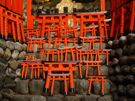 Little wooden torii gate at Fushimi Inari Shrine.