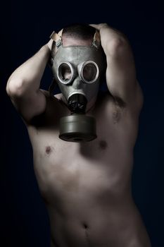 Fear, shirtless man and gas mask