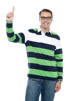 Smiling young man with raised finger. Excuse me, may I ?