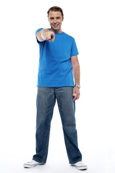 Handsome man pointing straight at you