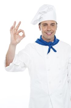 Handsome chef appreciating delicious meal. Tastes like heaven