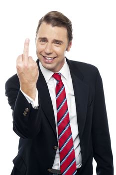 Image of a displeased businessman showing middle finger politely. Isolated against white