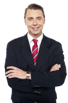 Arms crossed portrait of caucasian businessman, posing confidently